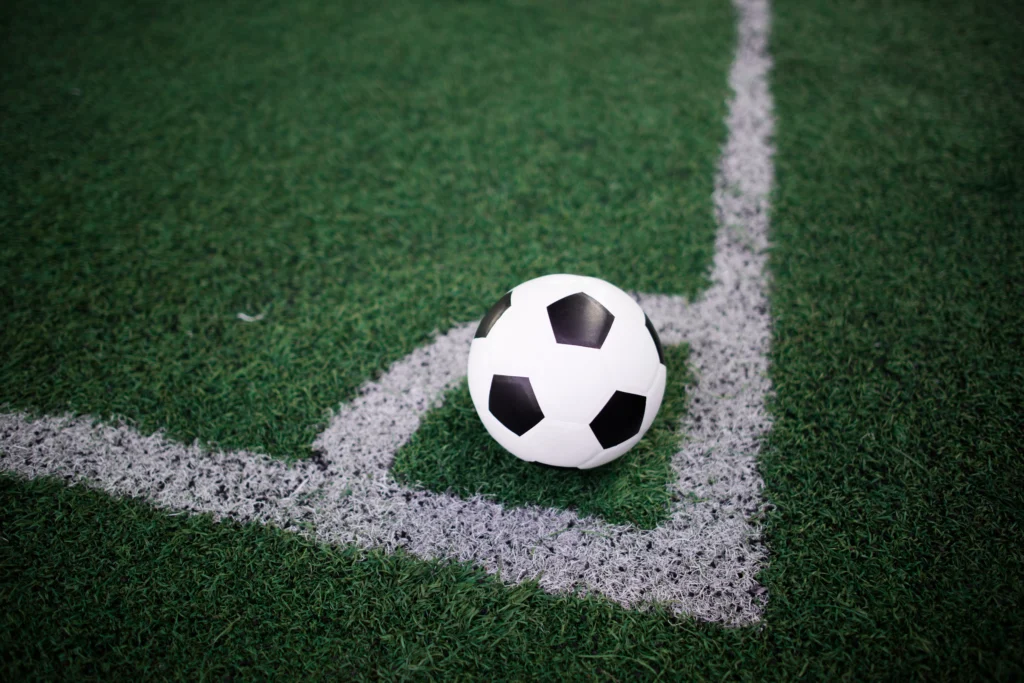 soccer-ball-on-the-white-line-at-stadium